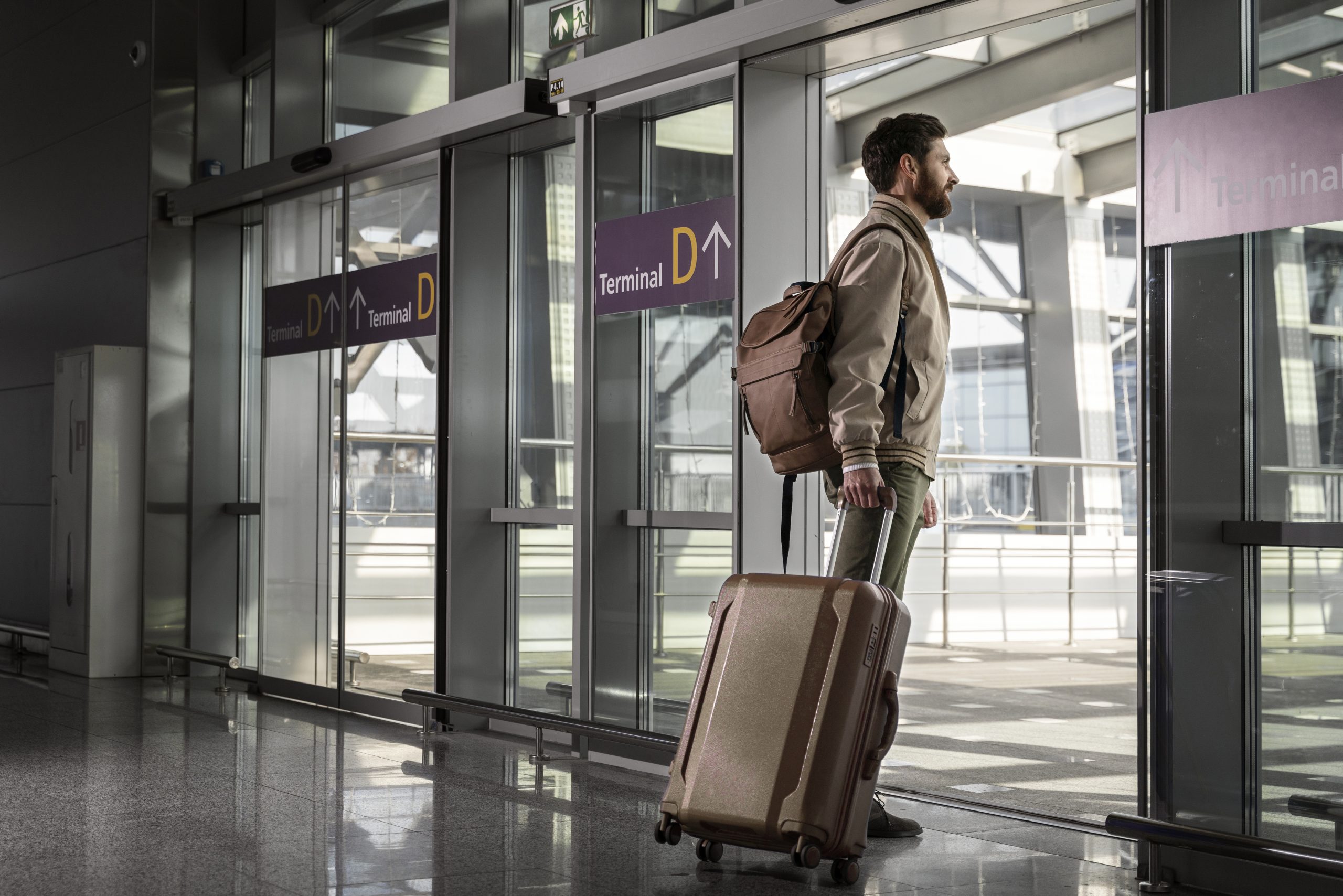 man coming out of airport