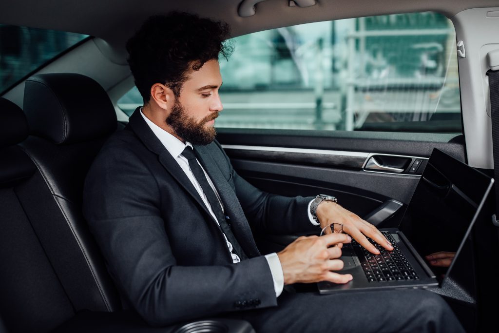 men sitting in taxi from Gatwick to Hammersmith