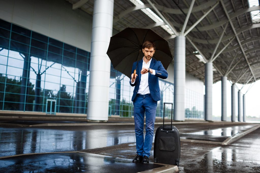 person waiting at airport for Taxi Gatwick airport to Portsmouth british car transfer