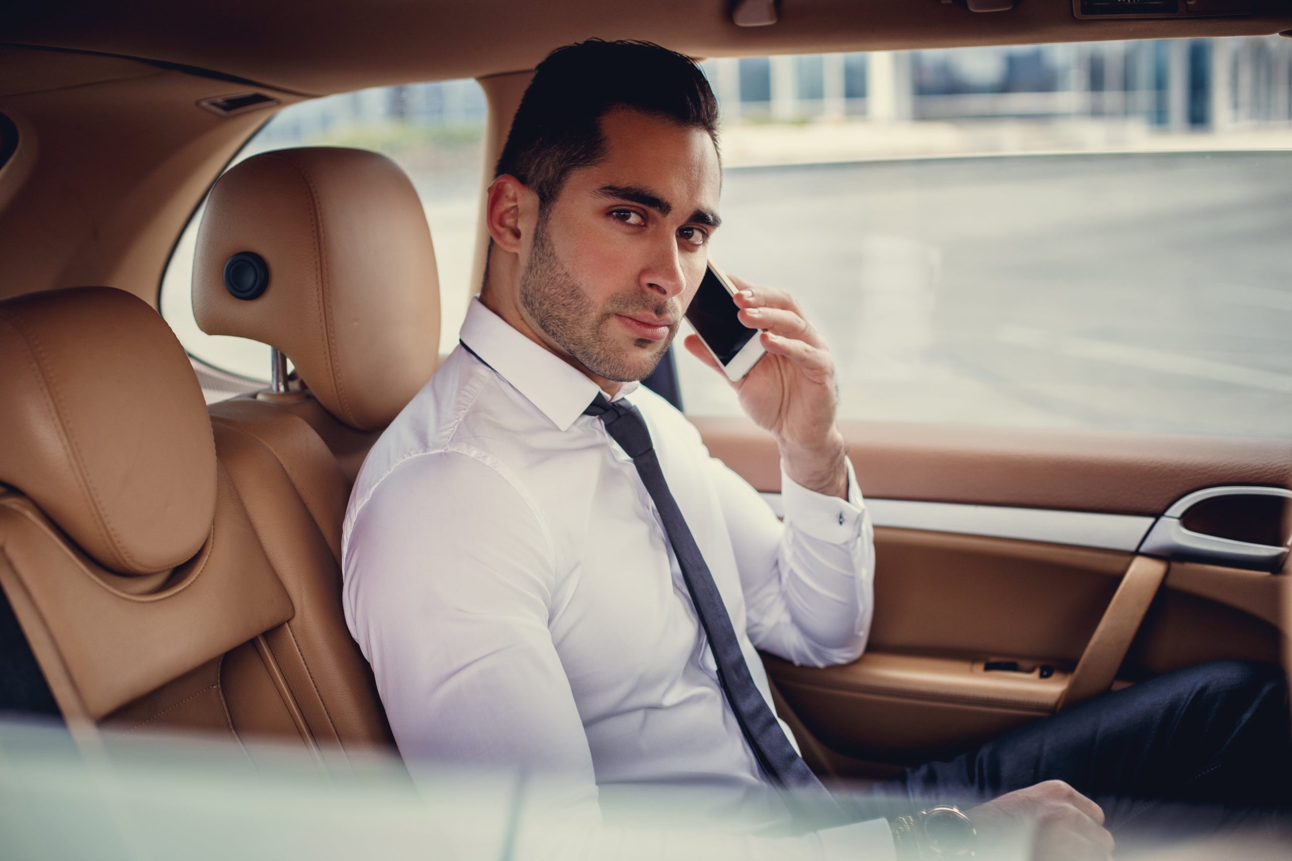 british car transfer driver on a phone call